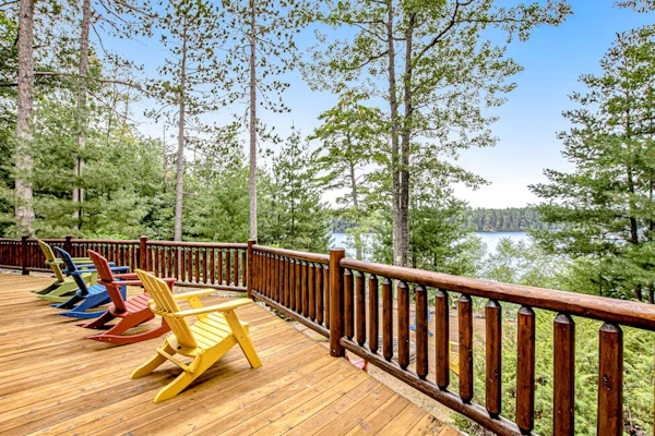 Lakefront log cabin on 3.5 acres with dock, gazebo & sunset views - dog-friendly