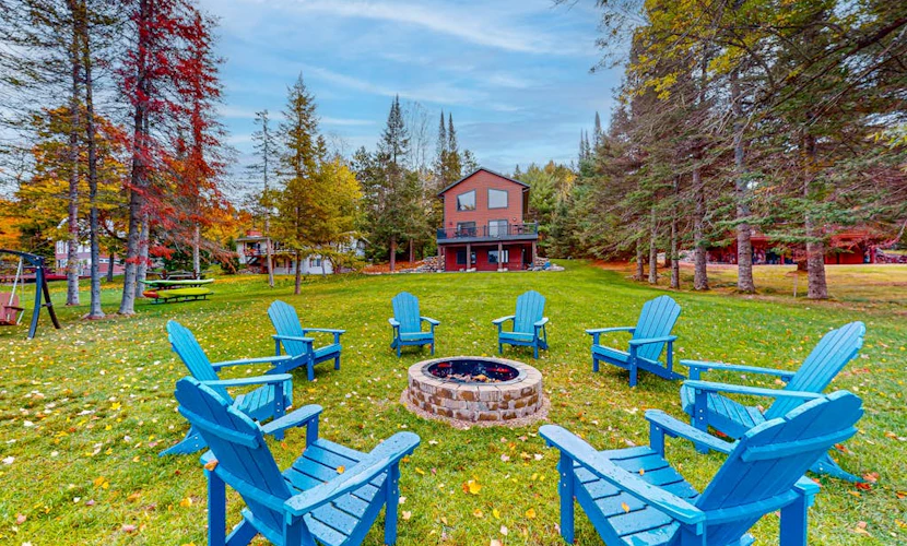 Lakefront home with yard, private dock, deck, firepit, & washer/dryer