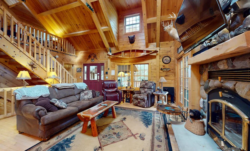Quaint lakefront cabin w/ indoor & outdoor fireplace, private dock - dogs OK