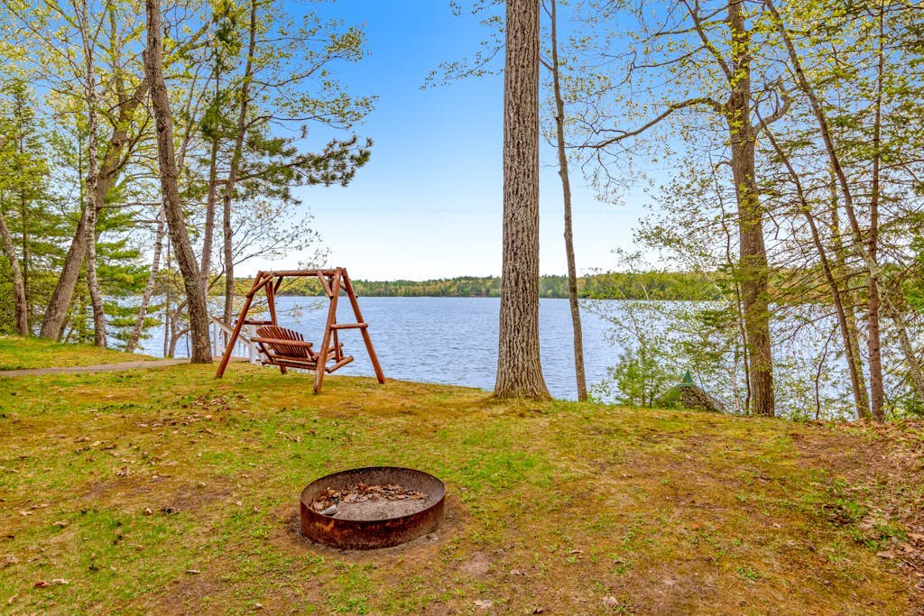 Updated home on private lake, two fireplaces, WiFi, W/D, & AC
