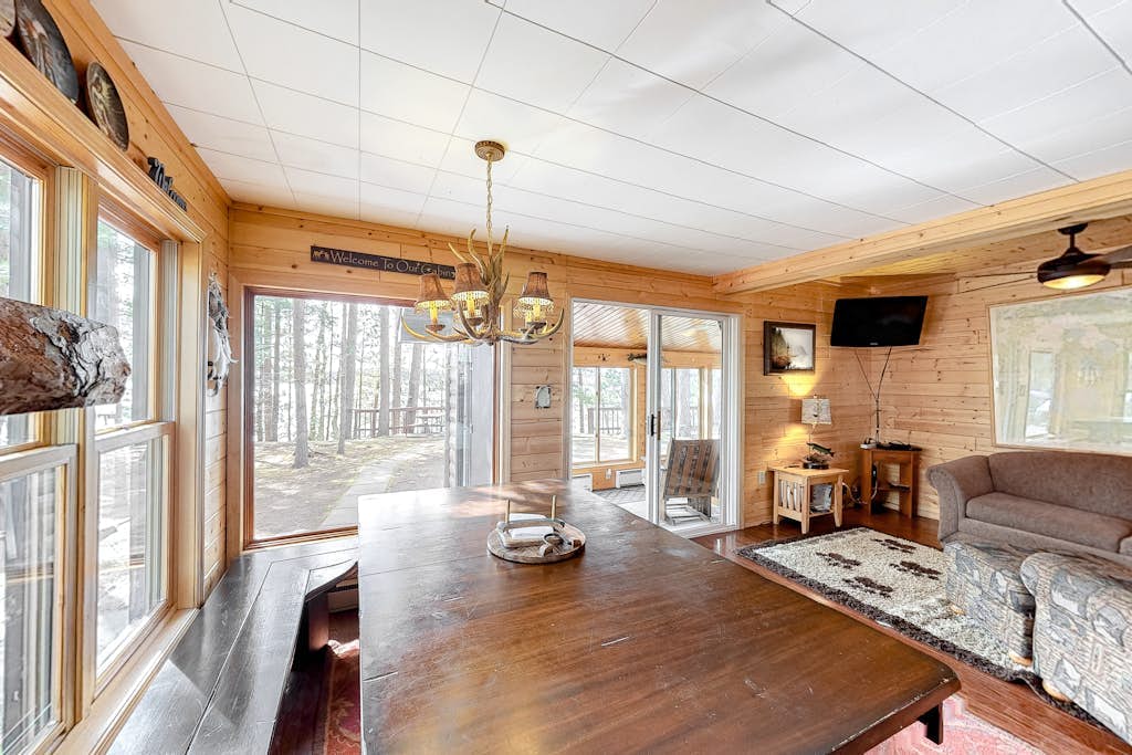Lakefront home with dock, swimming area, & wood stove - sunset views