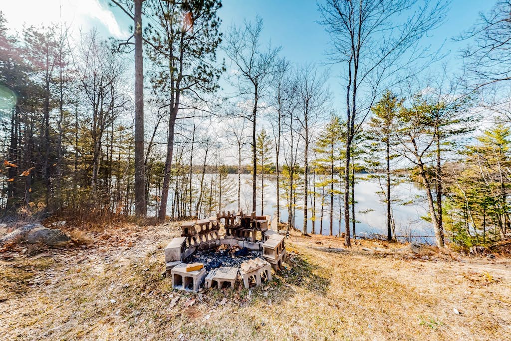 Quiet lakefront home with dock, canoe, & sunroom - dog-friendly