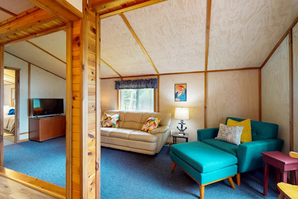 Lakefront cottage w/ a dock, shared furnished patio, firepit, & a paddleboat