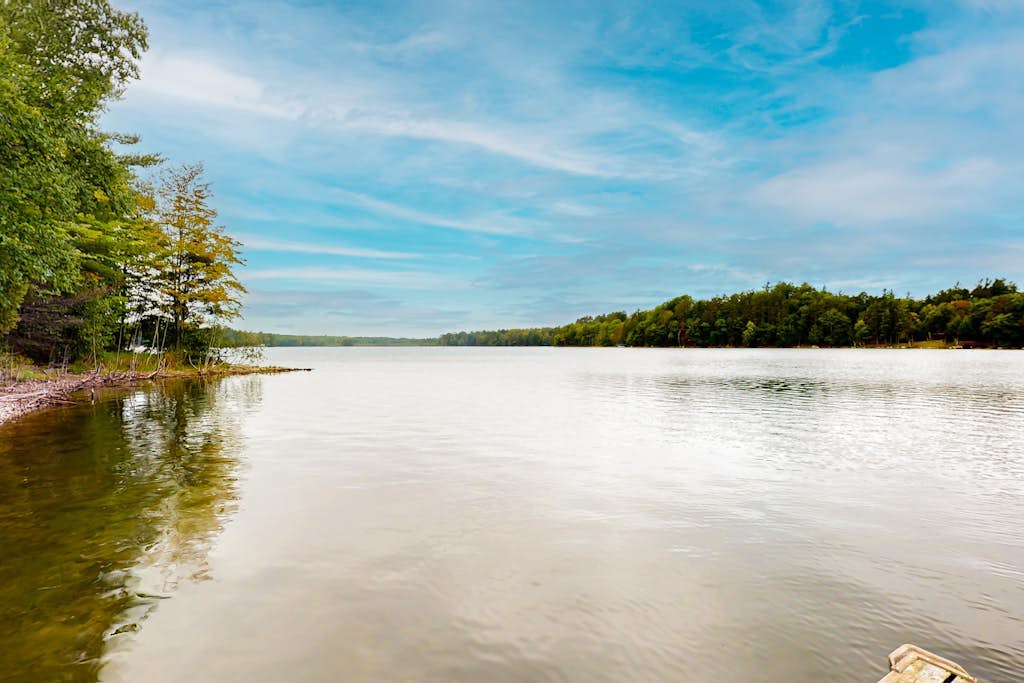 Lakefront home on South Two Lakes with lake views, lake access, firepit, & dock