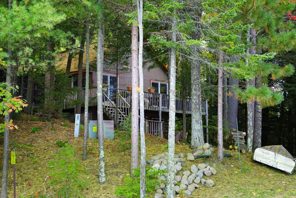 Lakefront dog-friendly retreat with sauna, dock, canoe, paddle board, & firepit