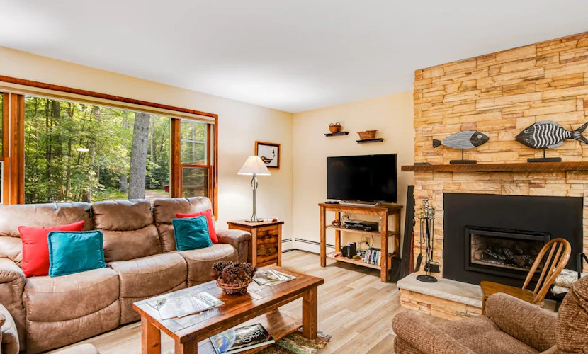 Charming riverfront home with a fireplace, dock, washer/dryer - close to town