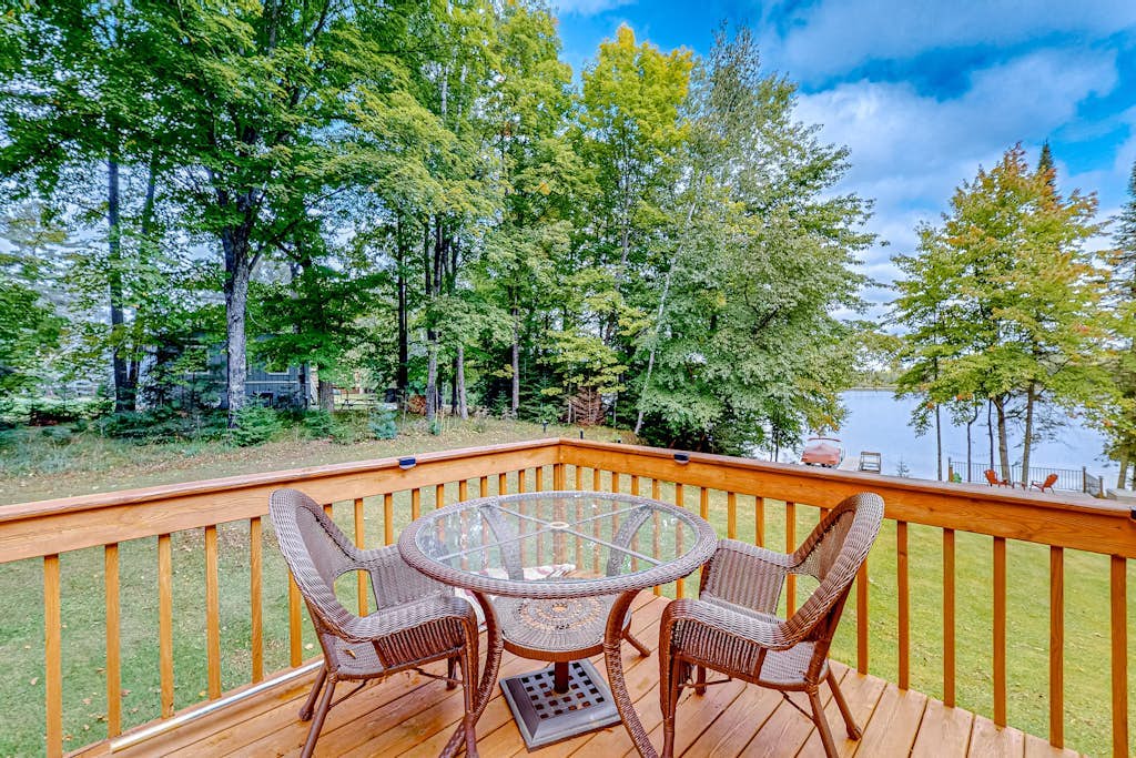 Dog-friendly lakefront home with a private beach, dock, firepit, & kayaks