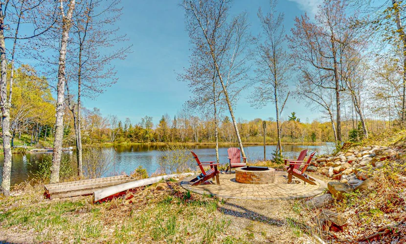 Lakefront home with large patio, fire pit, & a provided kayak