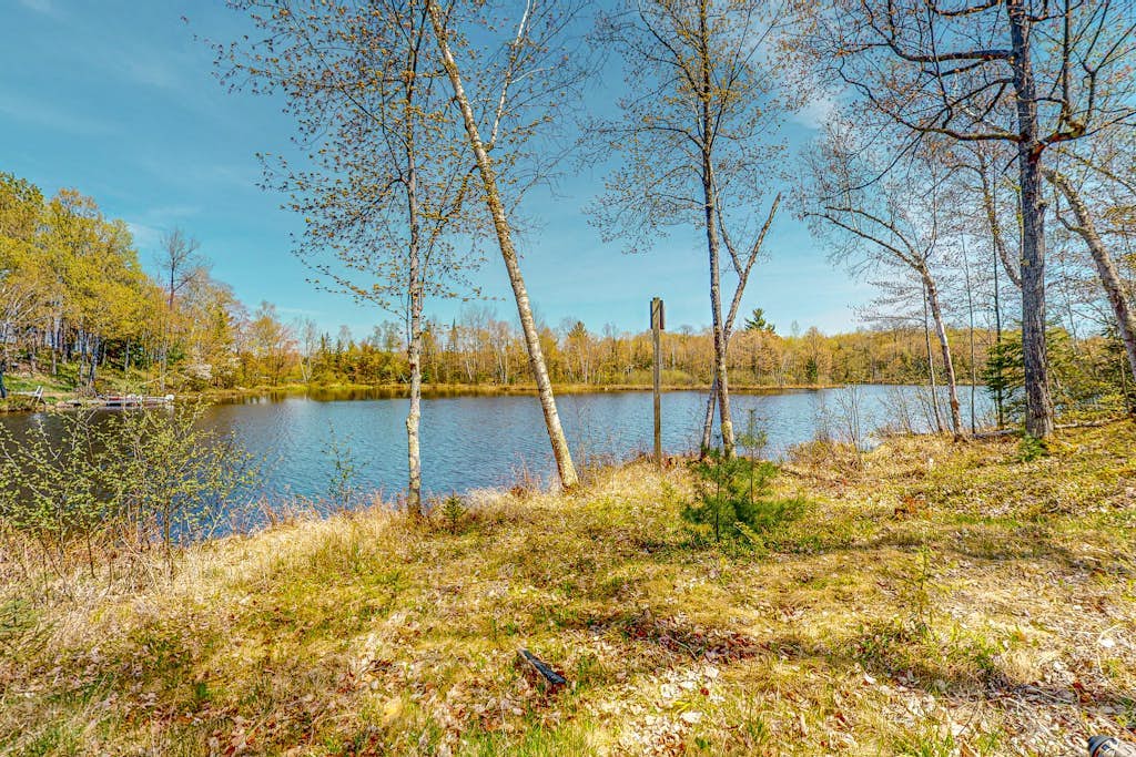 Lakefront home with large patio, fire pit, & a provided kayak