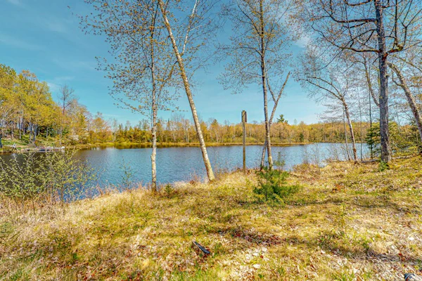 Lakefront home with large patio, fire pit, & a provided kayak