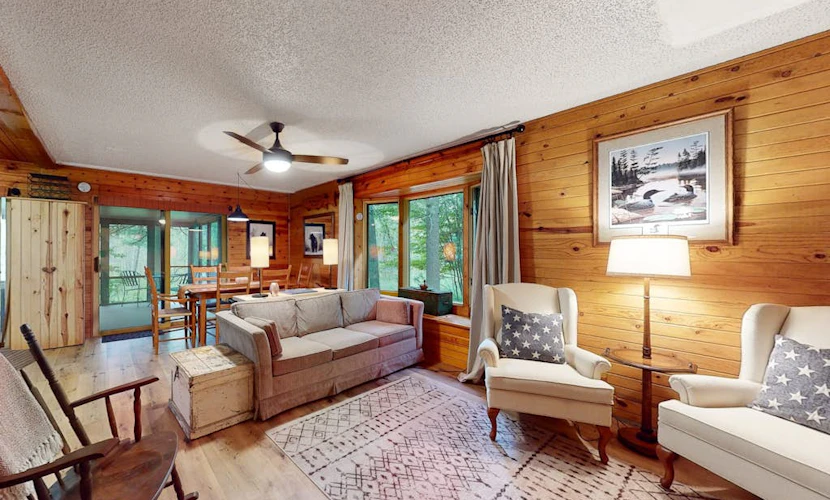 Lakefront cabin with kayaks, firepit, dock & spacious interior