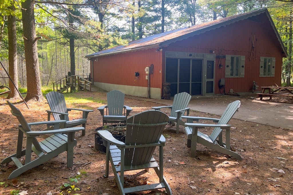 Lakefront cabin with kayaks, firepit, dock & spacious interior
