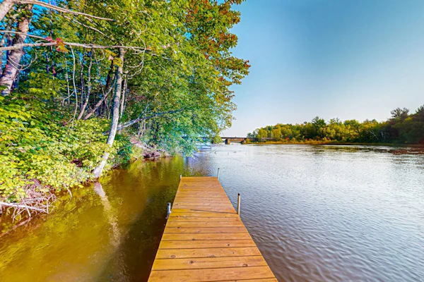 New dog-friendly cabin with river views, grill, modern interior, W/D, and AC