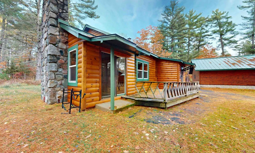 Cozy riverfront cabin with dock, fire pit, and WiFi on the 10-Lake Chain