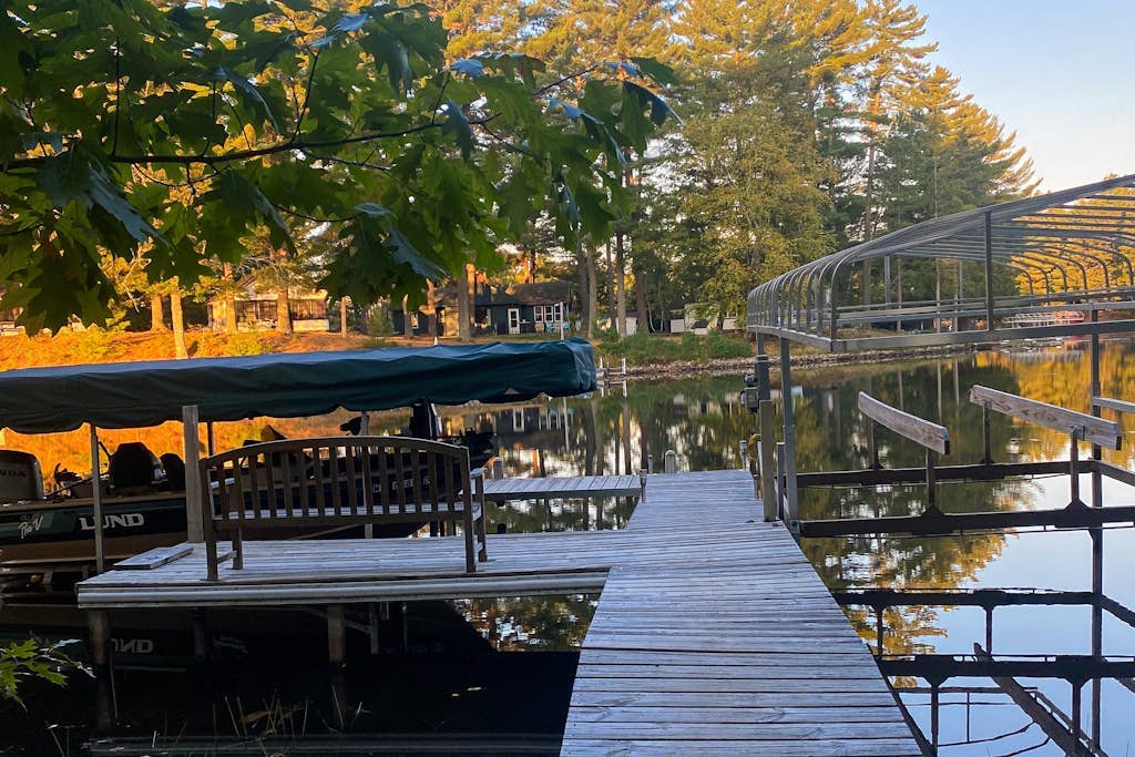 Cozy riverfront cabin with dock, fire pit, and WiFi on the 10-Lake Chain