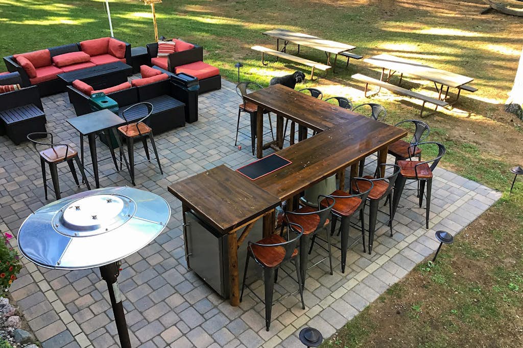 Riverfront home on the Manitowish Riverway w/ dock, fire pit, & outdoor mini bar