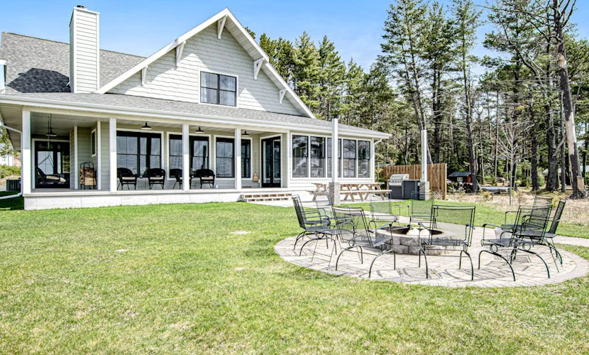 Dog-friendly, lakefront house with beach access, dock, AC, W/D, patio, & firepit