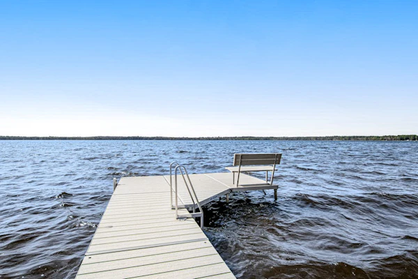 Dog-friendly, lakefront house with beach access, dock, AC, W/D, patio, & firepit