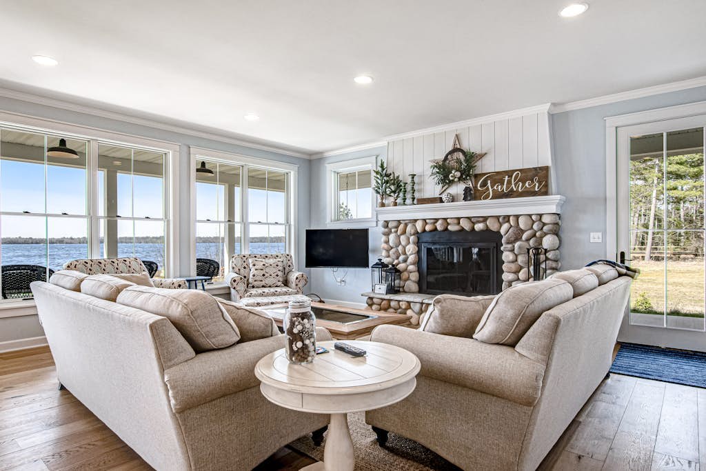 Dog-friendly, lakefront house with beach access, dock, AC, W/D, patio, & firepit