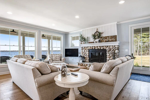 Dog-friendly, lakefront house with beach access, dock, AC, W/D, patio, & firepit
