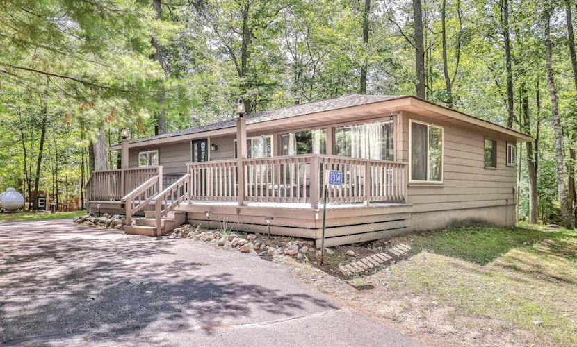Renovated lake-view retreat with full rec lake access, boat slips, & firepits