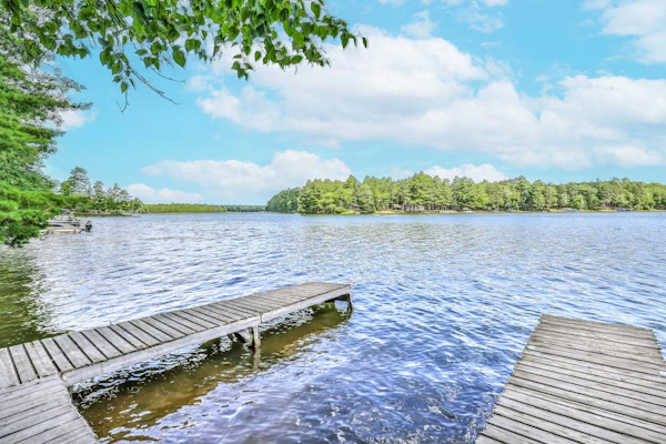 Renovated lake-view retreat with full rec lake access, boat slips, & firepits