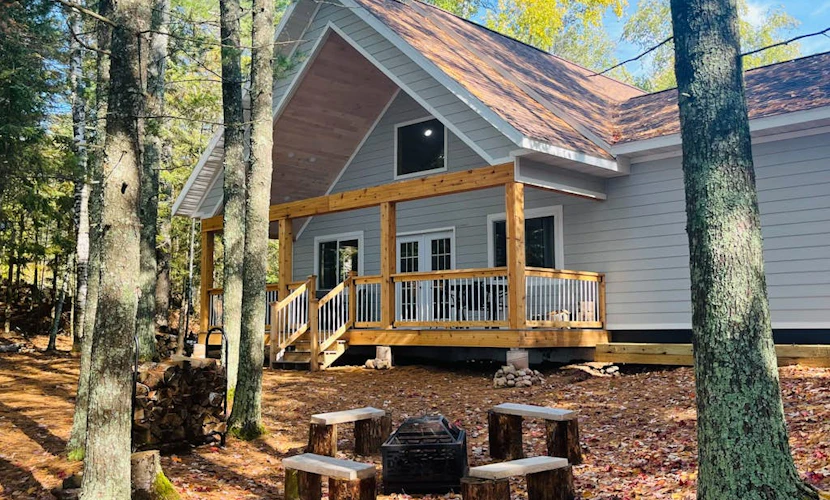 Dog-friendly, lakefront getaway with a firepit, dock, washer/dryer, & AC