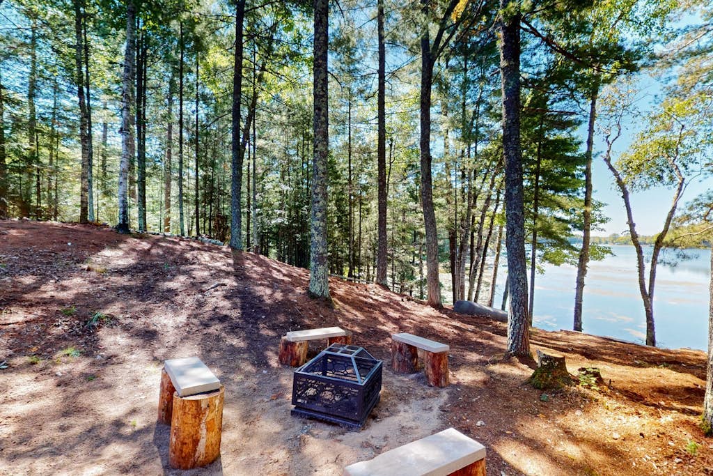Dog-friendly, lakefront getaway with a firepit, dock, washer/dryer, & AC