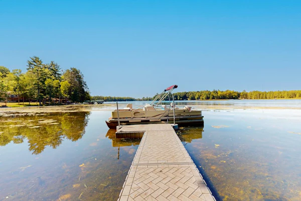 Dog-friendly, lakefront getaway with a firepit, dock, washer/dryer, & AC
