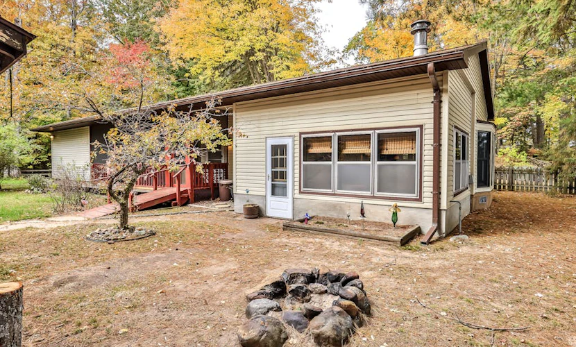 Lakefront home with private dock, screened porch, woodstove, fast WiFi, & W/D
