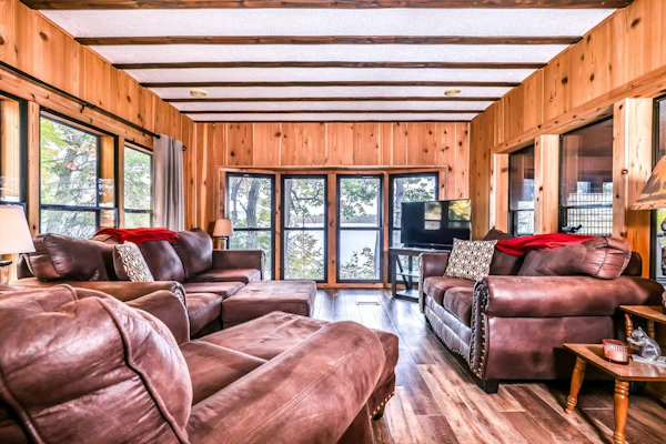 Lakefront home with private dock, screened porch, woodstove, fast WiFi, & W/D