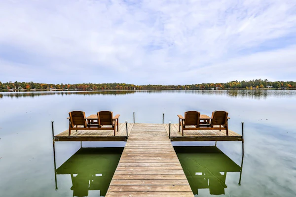 Lakefront home with private dock, screened porch, woodstove, fast WiFi, & W/D