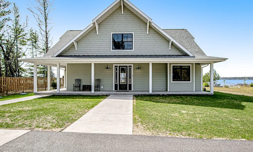 Two dog-friendly lakefront homes with docks, kayaks, rowboat, firepits & beach