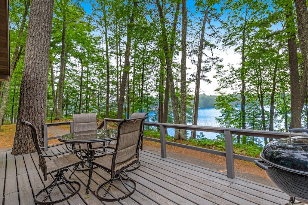Snowy lake-view cabin with fireplace, full kitchen, TV, dock, & DVD player
