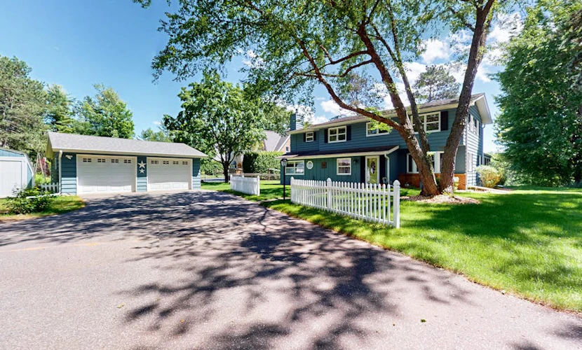 Gorgeous lakefront home with dock, sandy beach area, fireplace, huge deck & WIFI