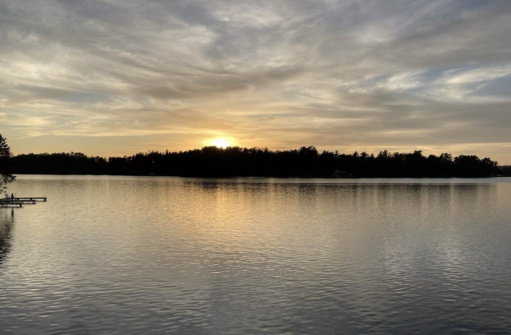 Gorgeous lakefront home with dock, sandy beach area, fireplace, huge deck & WIFI
