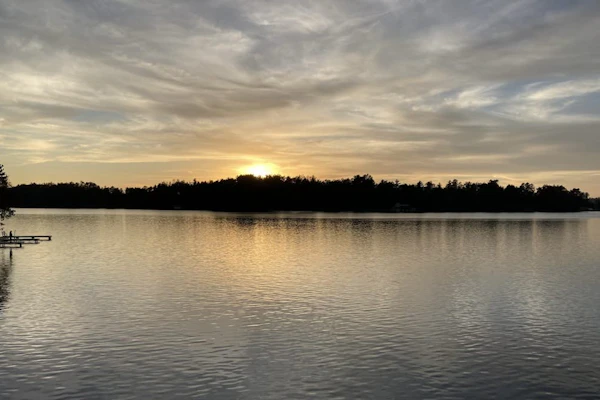 Gorgeous lakefront home with dock, sandy beach area, fireplace, huge deck & WIFI