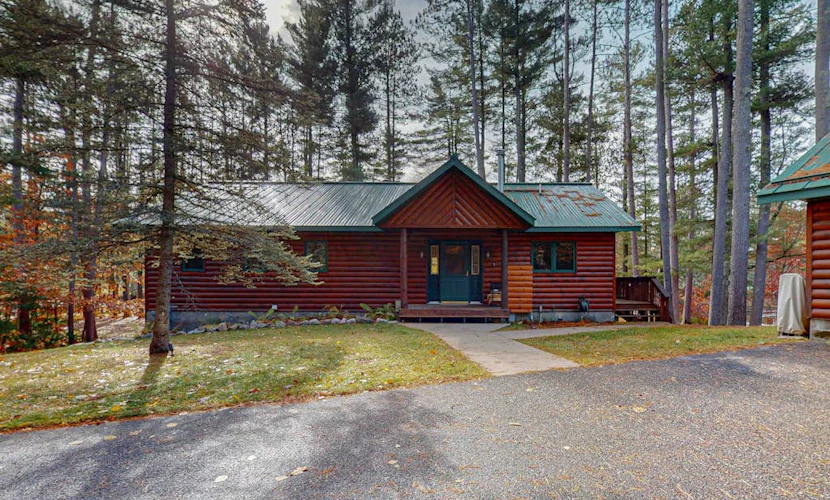 Riverfront retreat: 3BR home & 2BR cabin with docks, fire pits, and lake access