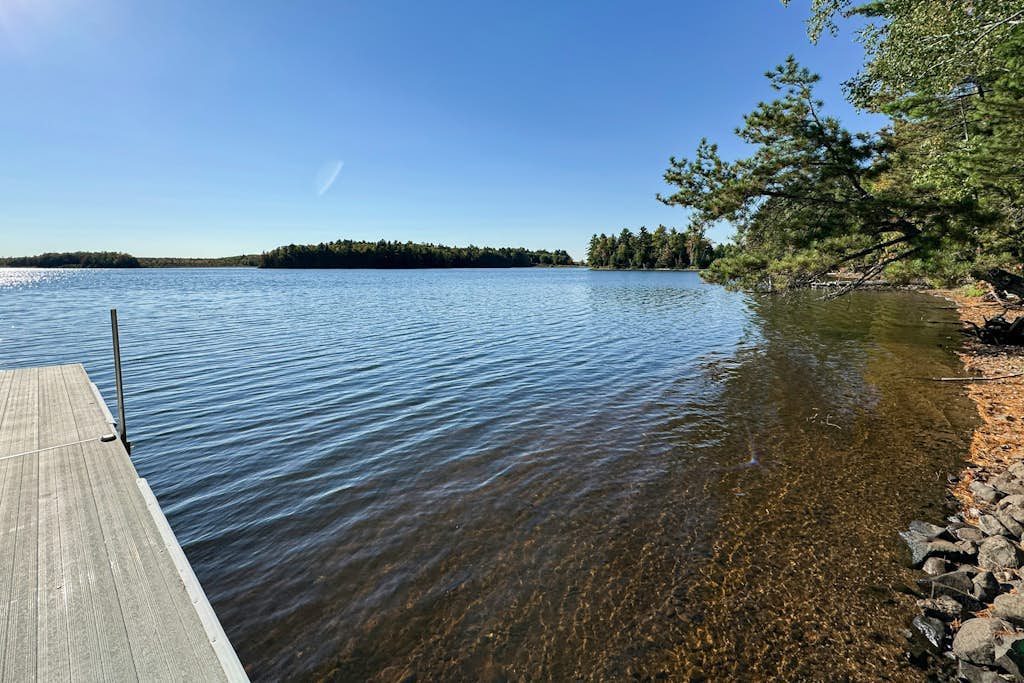 Waterfront home in great location with private dock, firepit &  deck