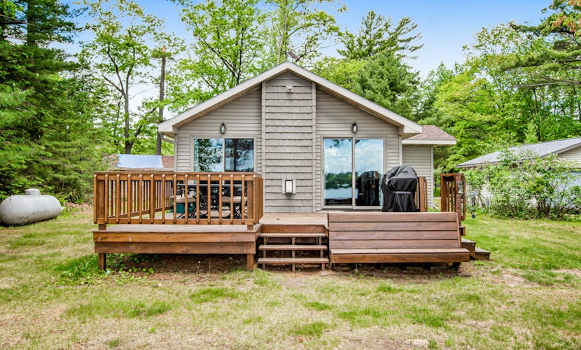Dog-friendly lakefront home with high-speed WiFi, dock, private w/d, & firepit