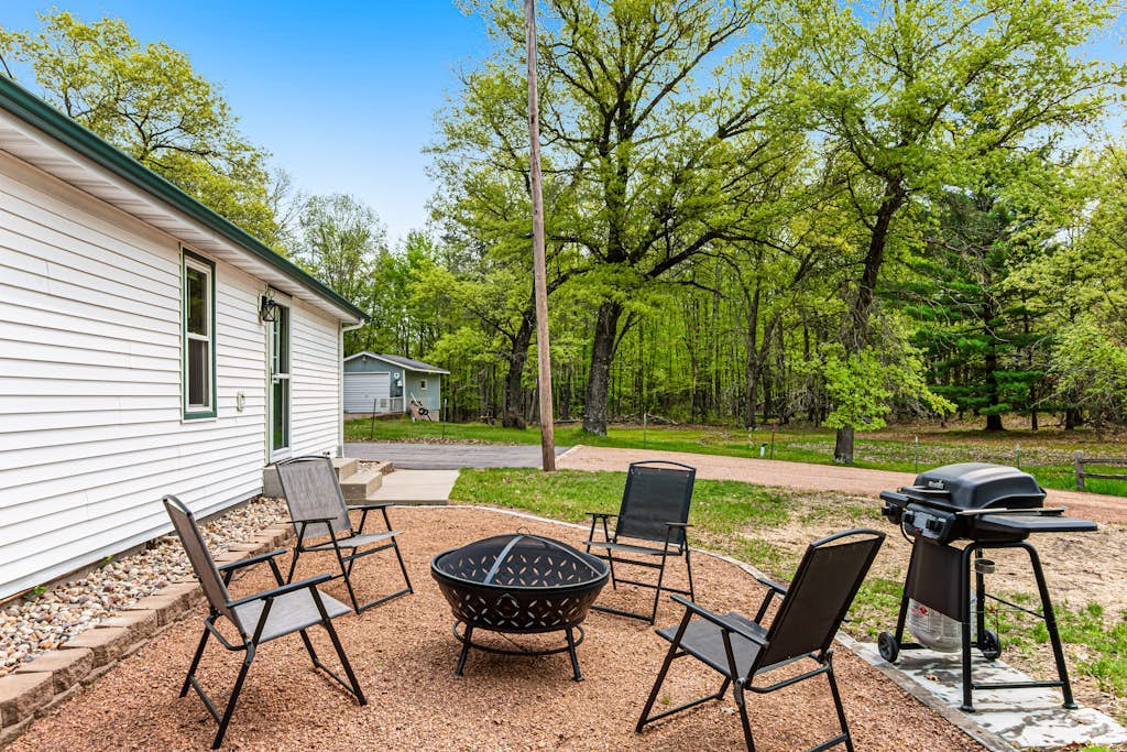 Rural retreat near Necedah National Wildlife Refuge with deck, firepit, & grill
