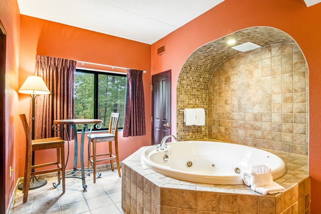 Spacious condo & studio with fireplaces, full kitchen, jetted tub, AC, & balcony