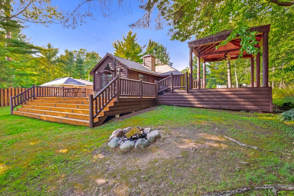 Dog-friendly waterfront cabin w/ wood-burning fireplace, boat dock, & firepit