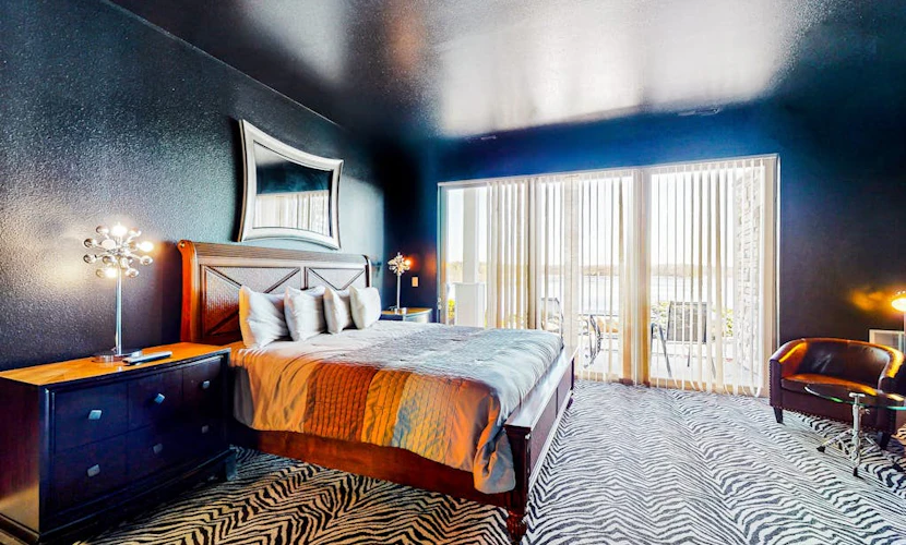 An unforgettable stay awaits at this sultry Delton Grand studio with dance pole