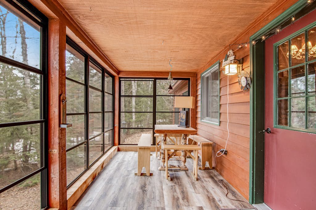 Riverfront vacation home with a dock, wood stove, full kitchen, & firepit
