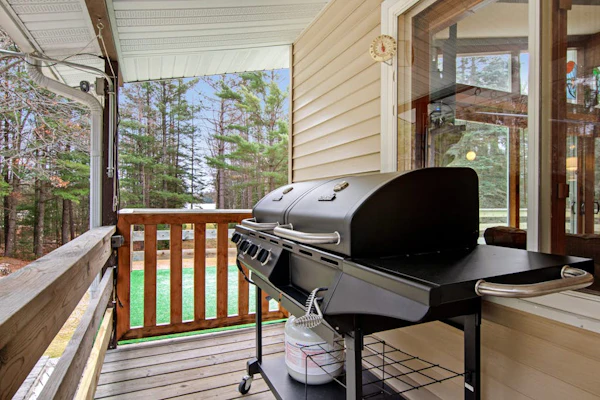 Lakefront Home with a Private Dock, Deck, Fireplace, Spacious Yard, & Playset