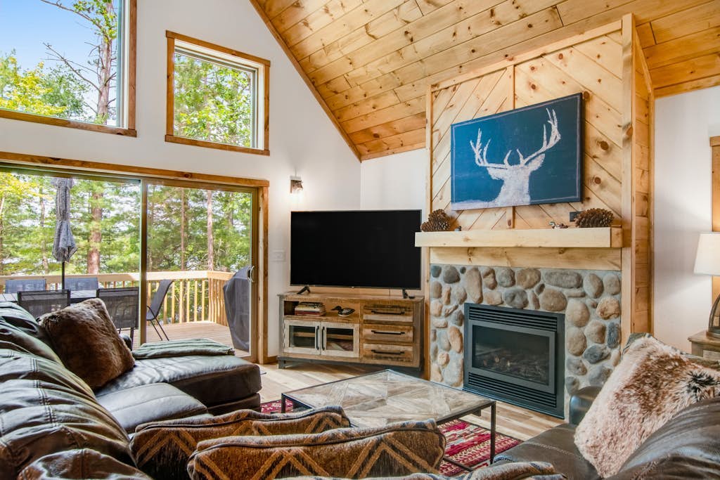 Gorgeous lake home with private pier, beach, firepit, deck, & grill + water toys