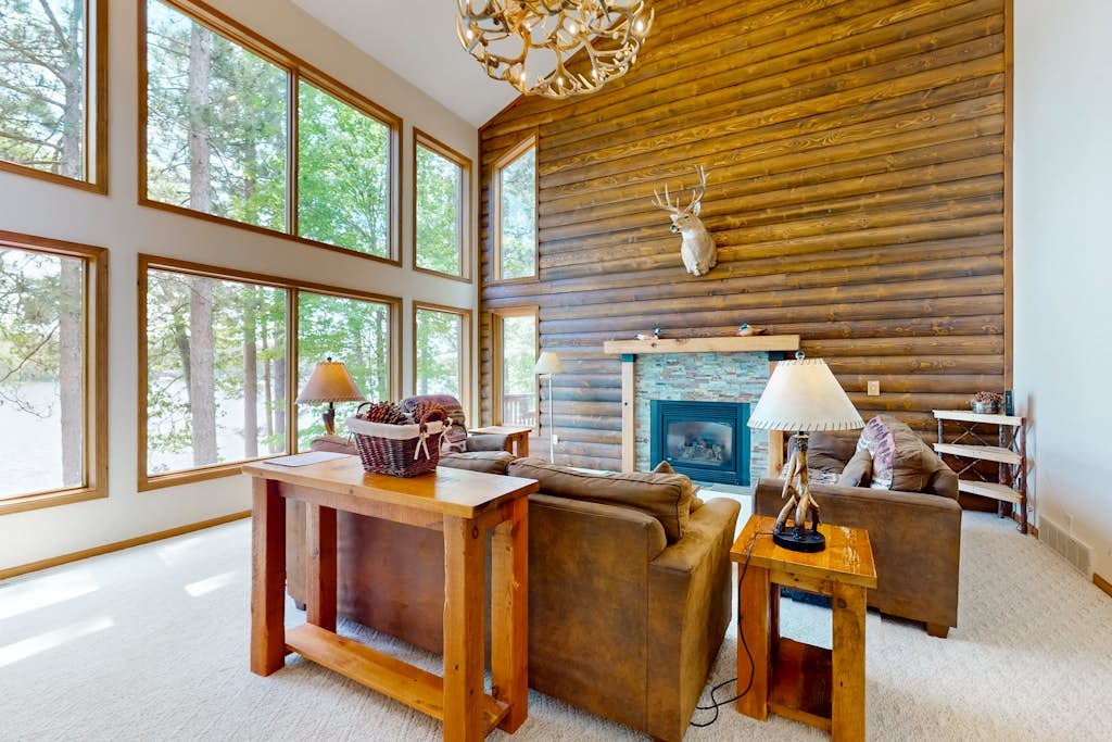 Picturesque Log Home with dock, fire pit,  pool table, & WIFI