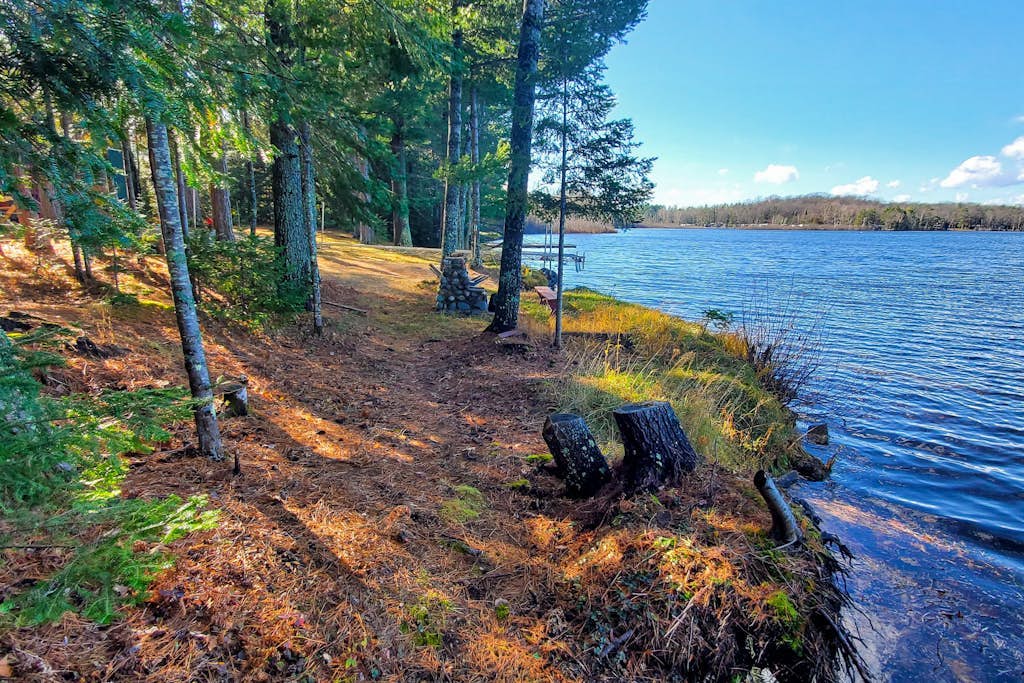 Lakefront home with, dock, kayaks, paddle boards, fire pit & more