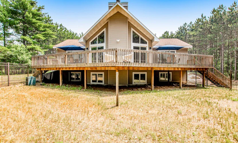 Secluded lake retreat with game room; near beach, boat rental, dining, and golf